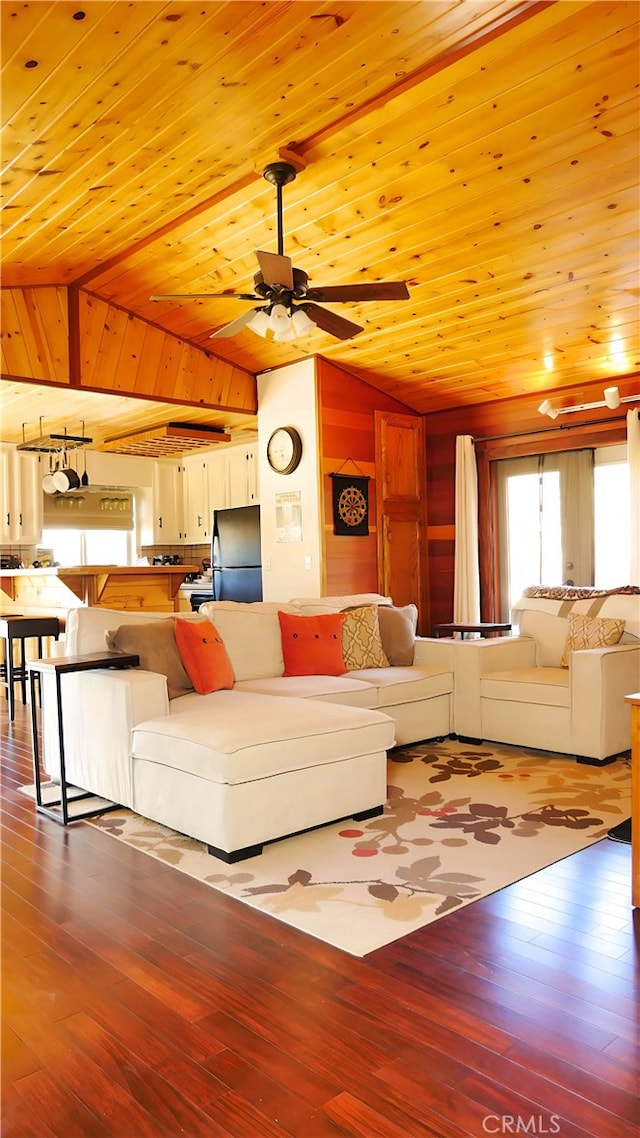 unfurnished living room with ceiling fan, wood ceiling, vaulted ceiling, and wood-type flooring