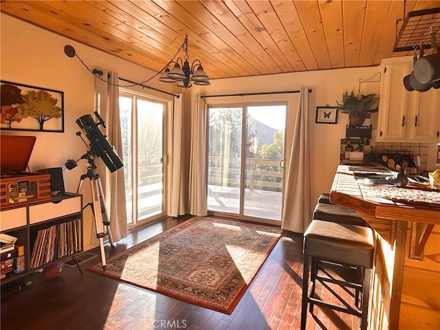 entryway featuring an inviting chandelier, wood ceiling, and dark hardwood / wood-style flooring