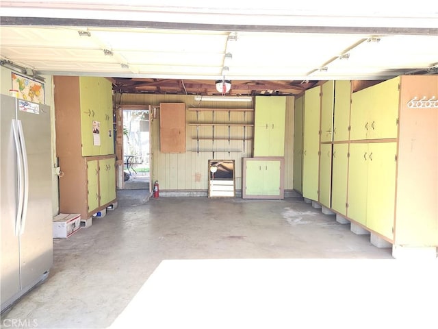 garage featuring stainless steel fridge