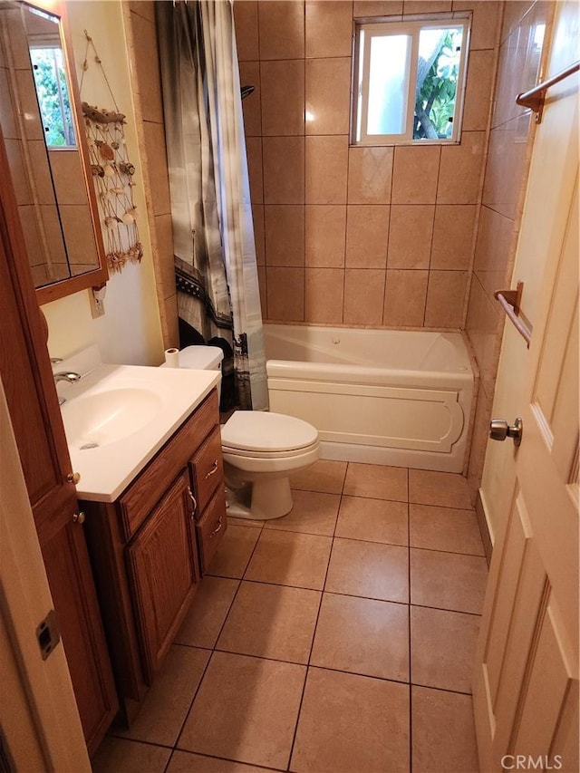 full bathroom featuring tile patterned floors, shower / bathtub combination with curtain, vanity, and toilet