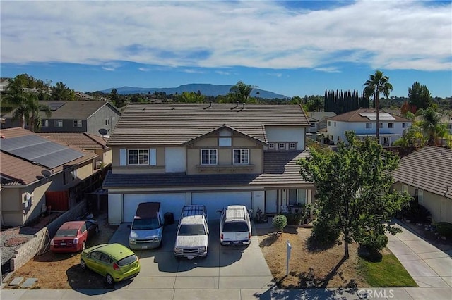 view of front of home featuring a mountain view