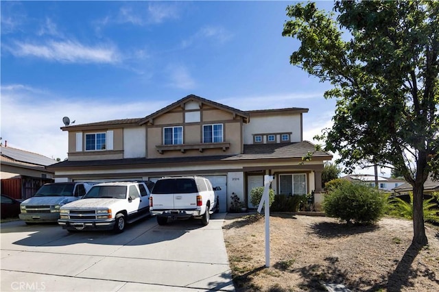 view of front of property with a garage