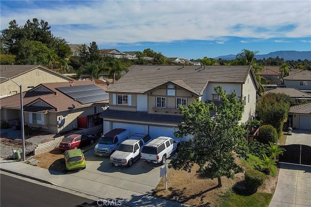 birds eye view of property with a mountain view