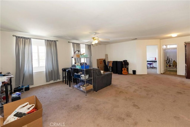 carpeted living room featuring ceiling fan