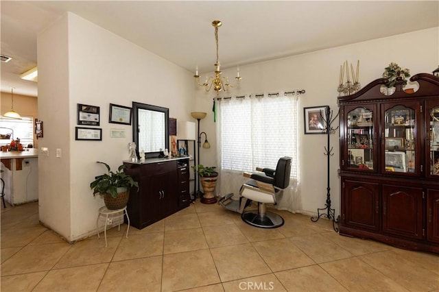 interior space with light tile patterned floors and an inviting chandelier