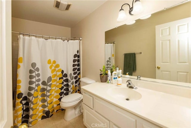 bathroom featuring tile patterned floors, curtained shower, vanity, and toilet