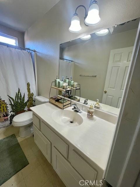 bathroom with tile patterned floors, vanity, curtained shower, and toilet