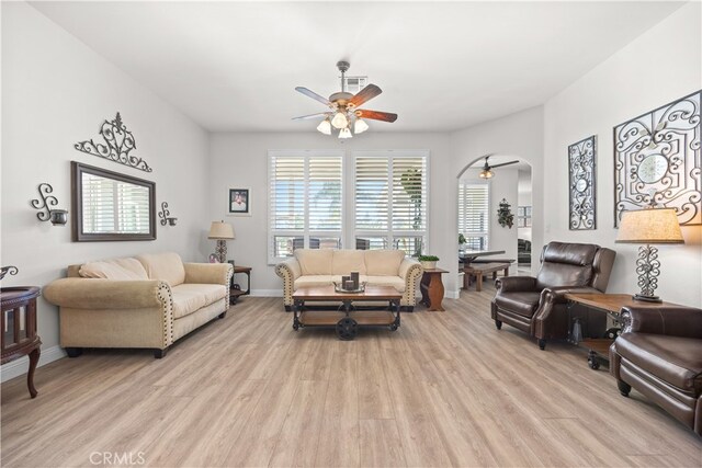 living room featuring light hardwood / wood-style floors and ceiling fan