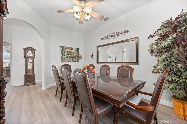 dining room with light hardwood / wood-style floors and ceiling fan