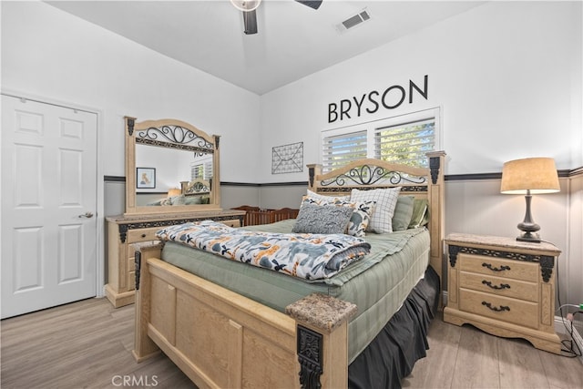 bedroom featuring light wood-type flooring and ceiling fan