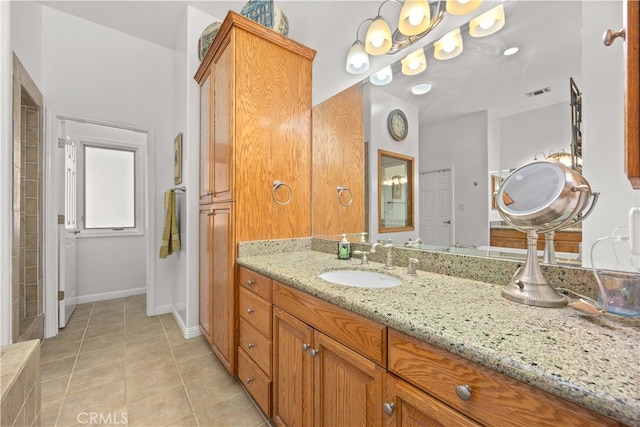 bathroom with vanity and tile patterned floors