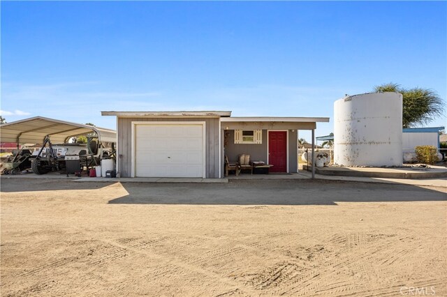 garage featuring a carport