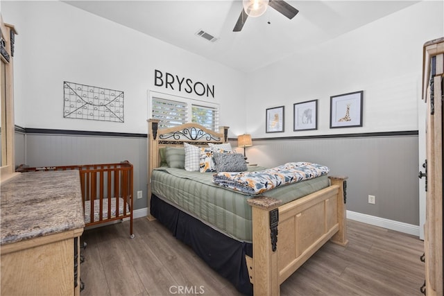 bedroom featuring ceiling fan and dark hardwood / wood-style floors