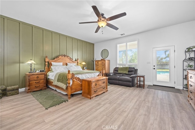 bedroom with ceiling fan, light wood-type flooring, and access to exterior