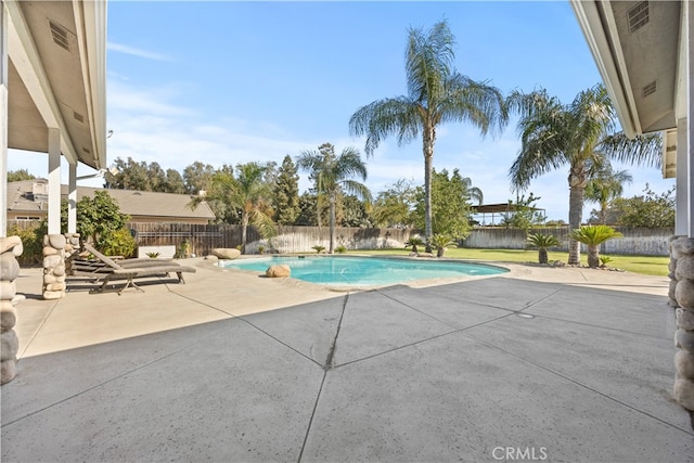 view of swimming pool featuring a patio area