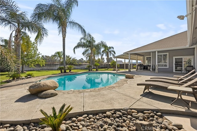 view of swimming pool with a patio