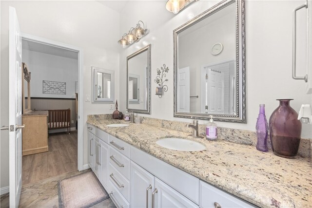 bathroom featuring vanity and hardwood / wood-style floors