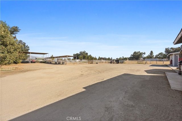 view of yard with a rural view