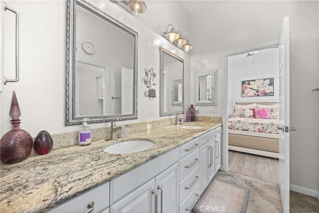 bathroom with vanity and hardwood / wood-style floors