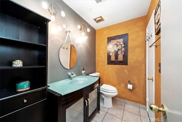 bathroom with tile patterned floors, toilet, and sink