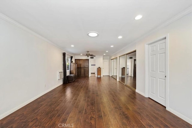 unfurnished living room featuring dark hardwood / wood-style floors, ceiling fan, and ornamental molding