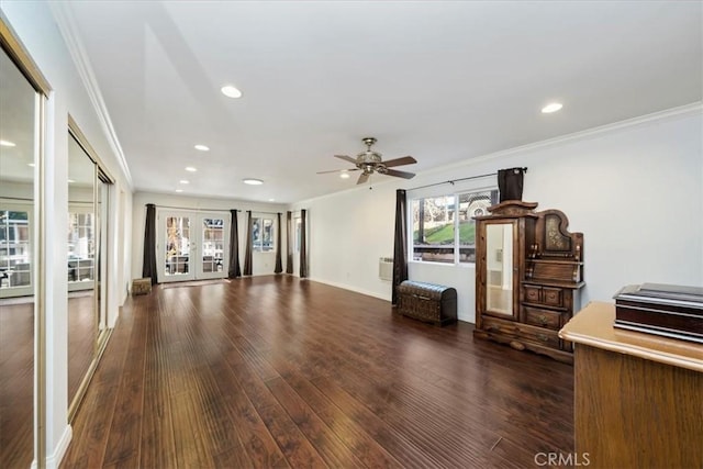 unfurnished living room featuring crown molding, french doors, ceiling fan, and dark wood-type flooring