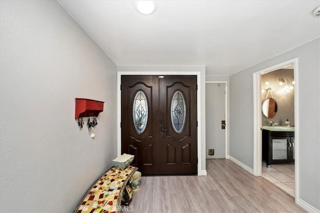 entryway featuring light hardwood / wood-style flooring and sink