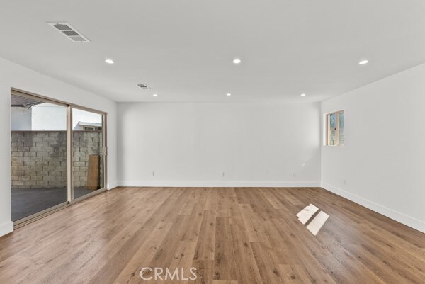 unfurnished room featuring light hardwood / wood-style floors