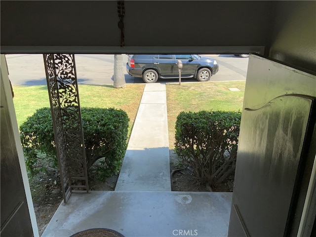 garage featuring a lawn