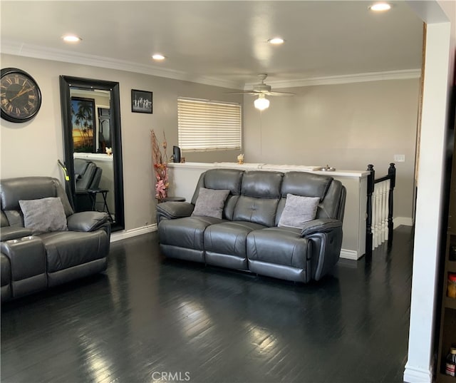 living room featuring crown molding, dark wood-type flooring, and ceiling fan