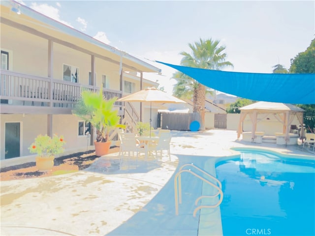 view of pool with a gazebo and a patio