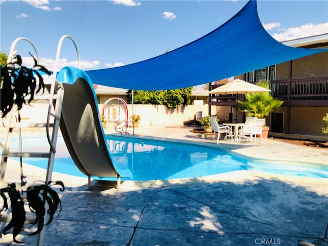 view of swimming pool featuring a patio