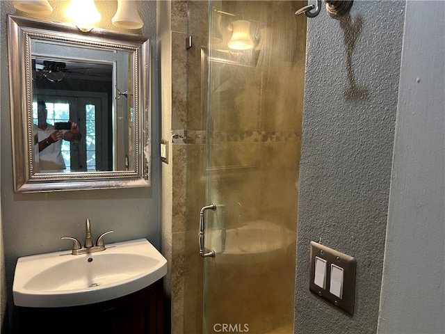 bathroom with vanity and an enclosed shower