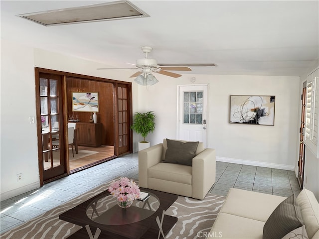 tiled living room with ceiling fan