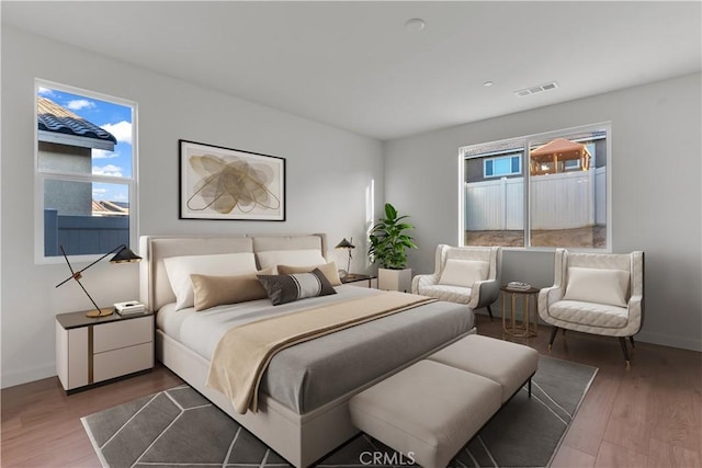 bedroom with hardwood / wood-style floors