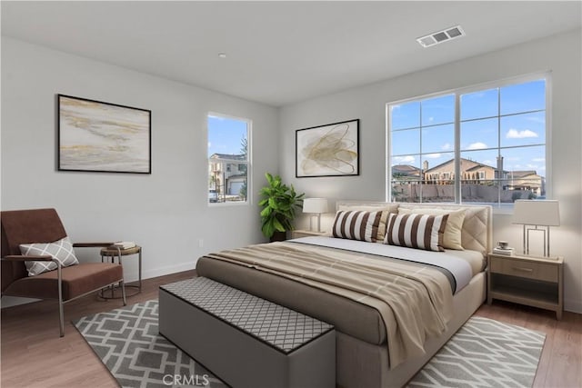 bedroom with hardwood / wood-style floors