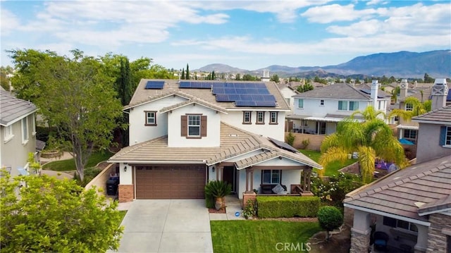 view of front of house featuring a mountain view and solar panels