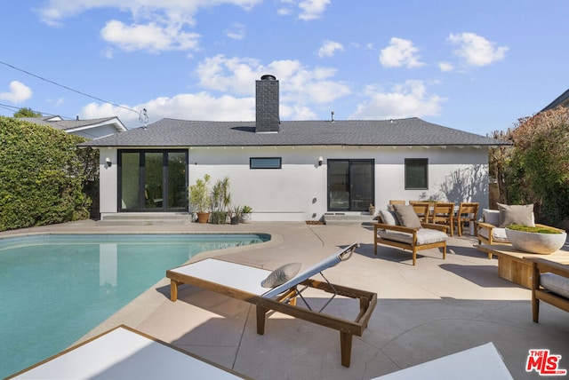 view of pool with an outdoor hangout area and a patio