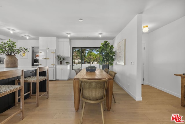 dining room with light hardwood / wood-style floors