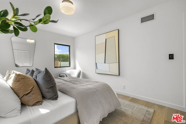 bedroom featuring hardwood / wood-style floors