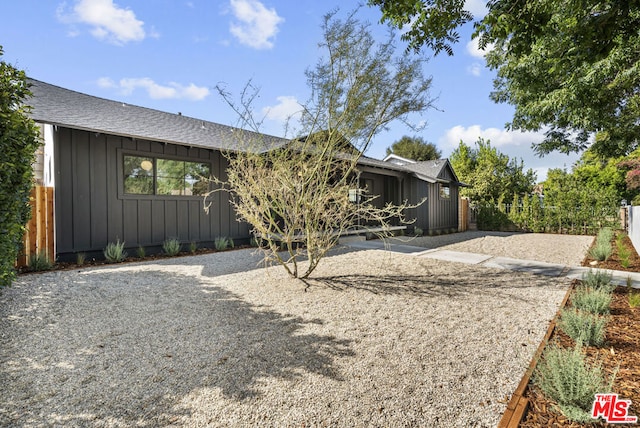 view of property exterior with a patio