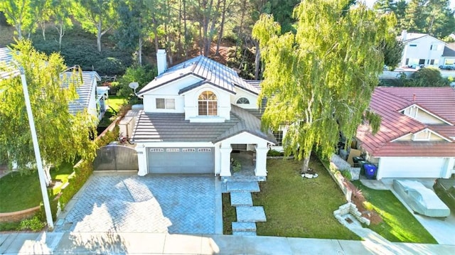 view of front of house with a front yard and a garage