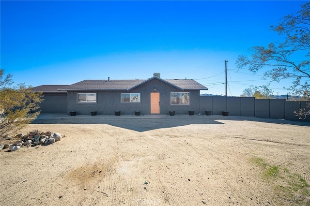 back of property featuring a garage