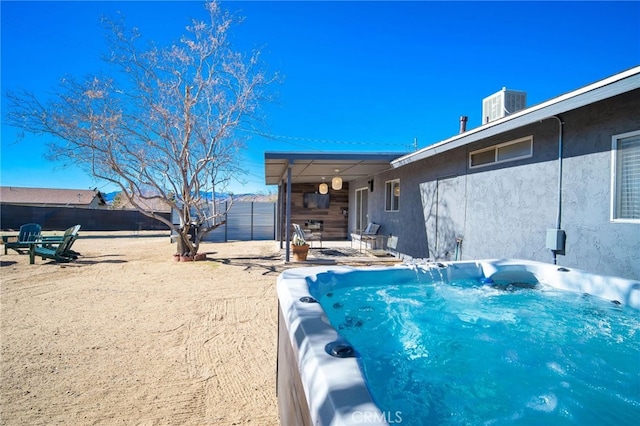 exterior space featuring a hot tub