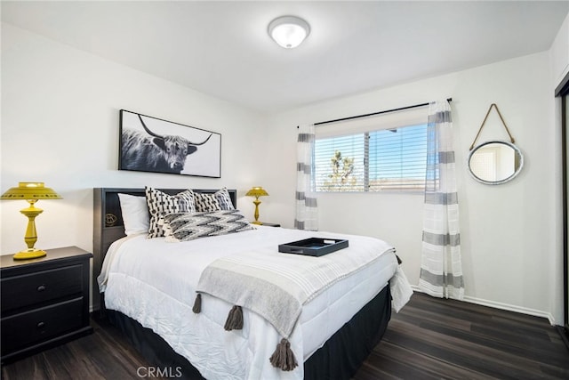 bedroom featuring dark hardwood / wood-style floors