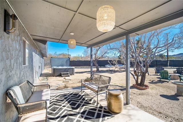 view of patio / terrace featuring a hot tub