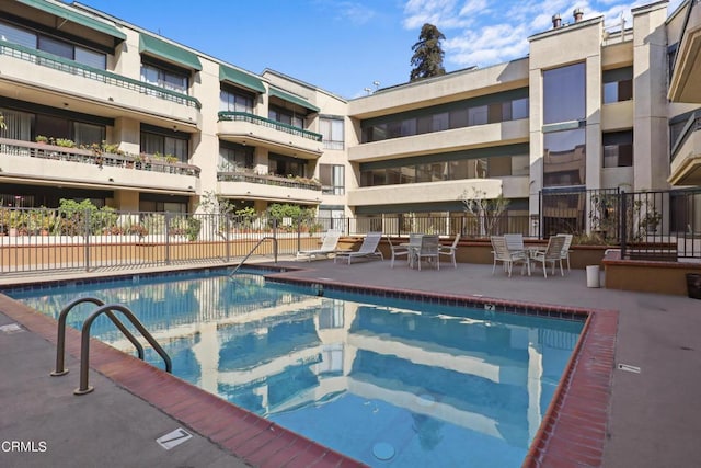 view of swimming pool featuring a patio