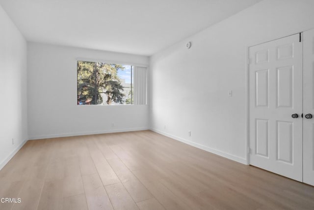 empty room with light wood-type flooring