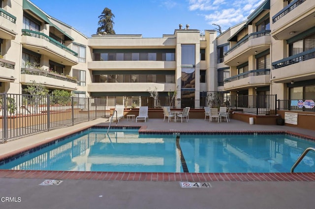 view of swimming pool featuring a patio