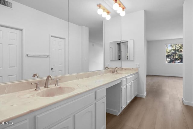 bathroom featuring vanity and hardwood / wood-style flooring